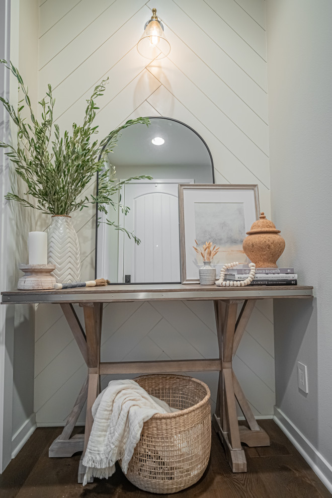 Inspiration for a small coastal entrance in Orange County with medium hardwood flooring, a single front door, a white front door, brown floors and panelled walls.