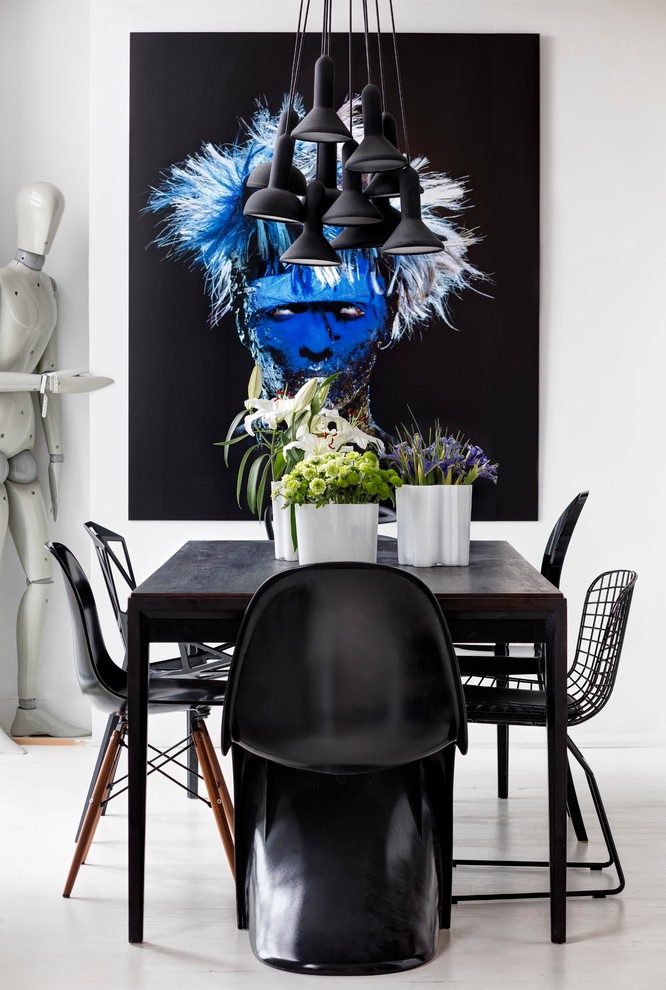 Inspiration for an eclectic dining room in Toronto with white walls.