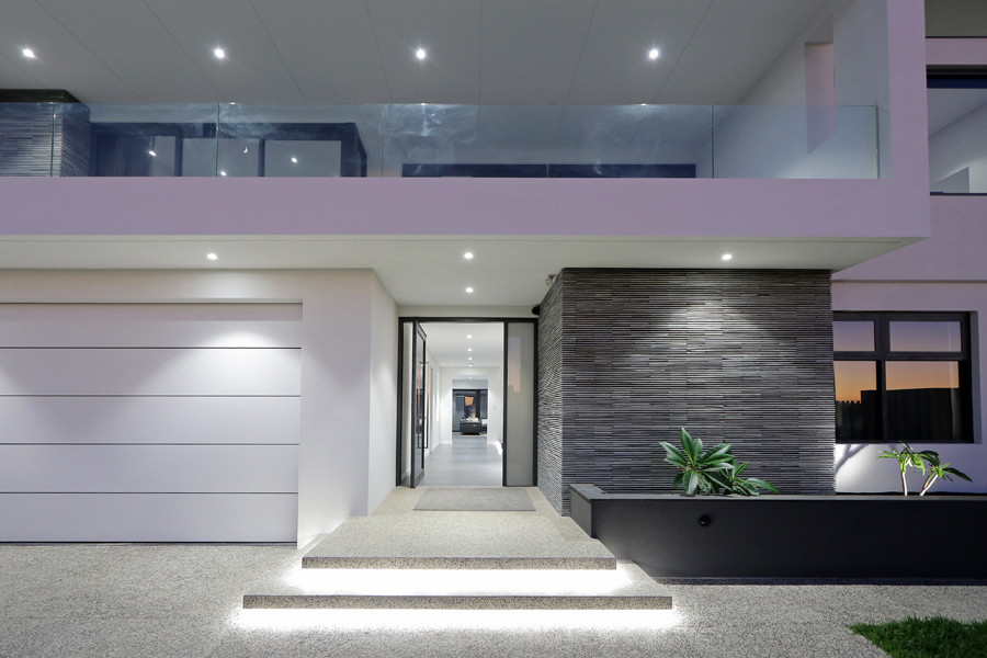 Inspiration for an expansive modern front door in Perth with white walls, ceramic floors, a pivot front door, a glass front door and grey floor.