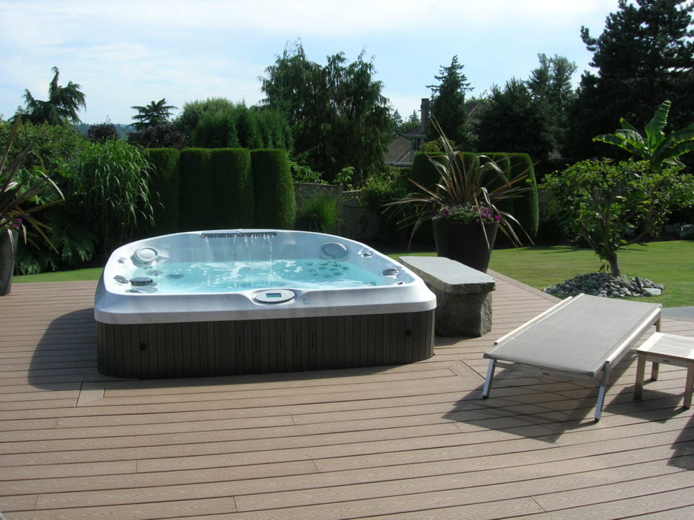Photo of a transitional backyard pool in San Francisco with a hot tub.