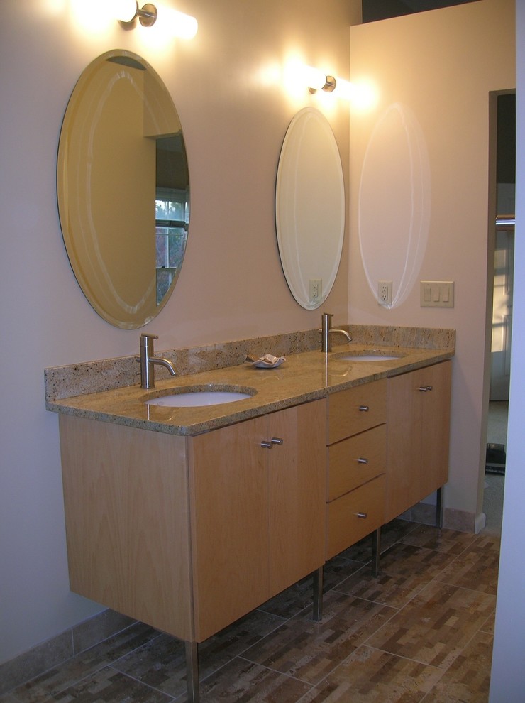Inspiration for a small modern master bathroom in Indianapolis with flat-panel cabinets, light wood cabinets, white walls, an undermount sink, granite benchtops, a corner tub, an open shower, a one-piece toilet, beige tile, white tile, stone tile, mosaic tile floors and an open shower.