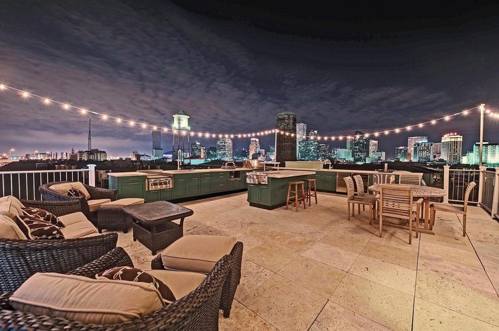 Photo of an expansive transitional rooftop deck in Houston with an outdoor kitchen and no cover.
