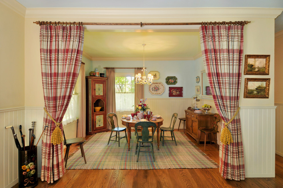 Inspiration for a country dining room in San Francisco with yellow walls.