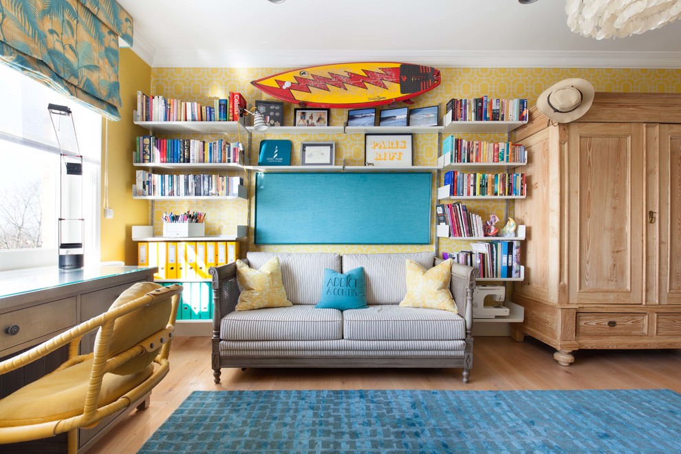 This is an example of a large eclectic kids' room for girls in London with yellow walls, light hardwood floors and beige floor.
