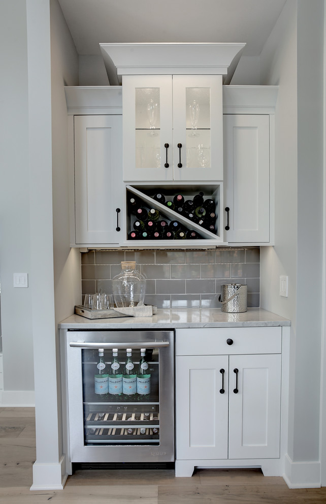 Inspiration for a transitional home bar remodel in Grand Rapids