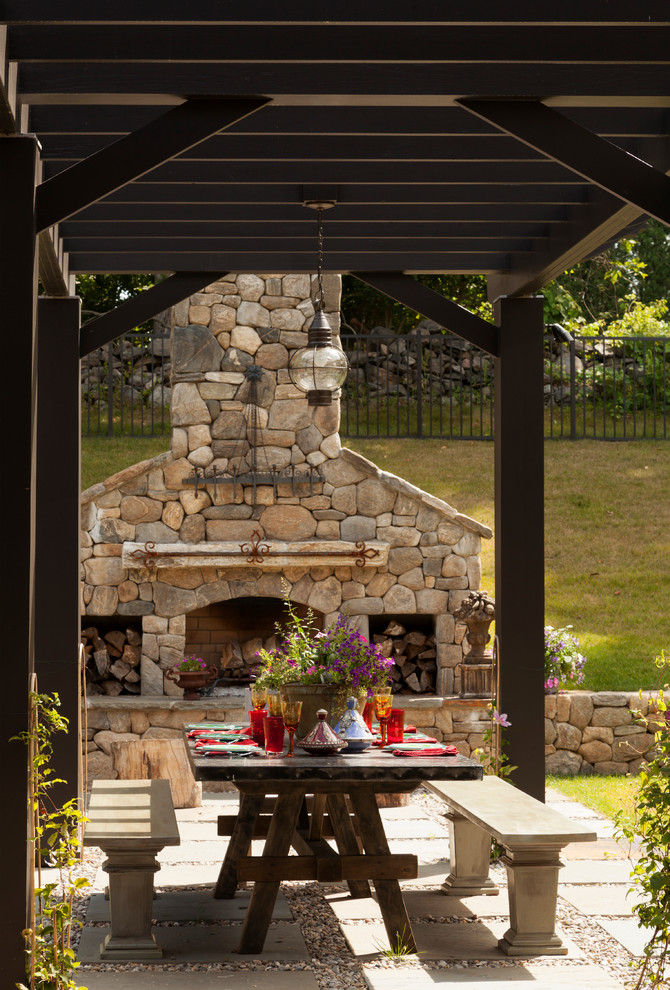 Inspiration for a traditional backyard patio in New York with a pergola.