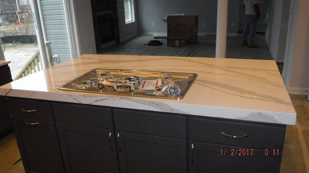 Example of a mid-sized transitional u-shaped home design design in Baltimore with shaker cabinets, gray cabinets, quartz countertops, stainless steel appliances and an island
