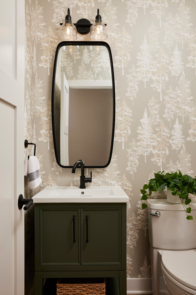 Powder room - small transitional vinyl floor, brown floor and wallpaper powder room idea in Minneapolis with recessed-panel cabinets, green cabinets, a one-piece toilet, an undermount sink, quartz countertops, white countertops and a freestanding vanity