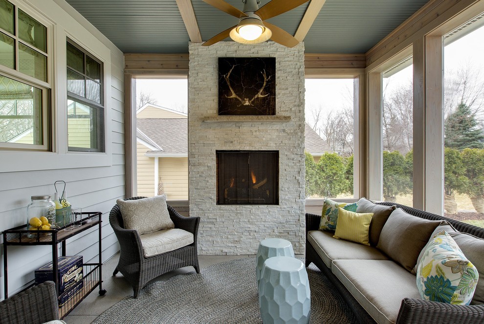 Inspiration for a traditional sunroom in Minneapolis with a ribbon fireplace, a brick fireplace surround and a standard ceiling.