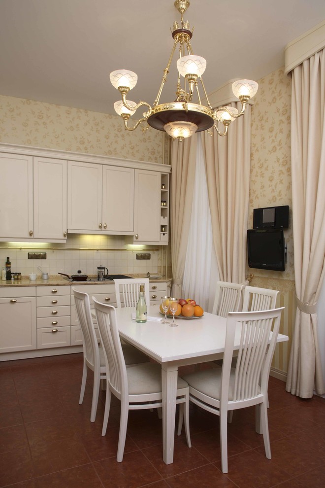 Photo of a mid-sized traditional l-shaped eat-in kitchen in Moscow with a drop-in sink, white cabinets, marble benchtops, white splashback, ceramic splashback, porcelain floors, no island, brown floor and beige benchtop.