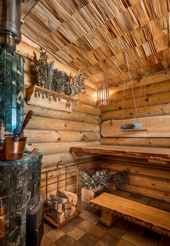 Large rustic sauna bathroom in Other with wood walls.