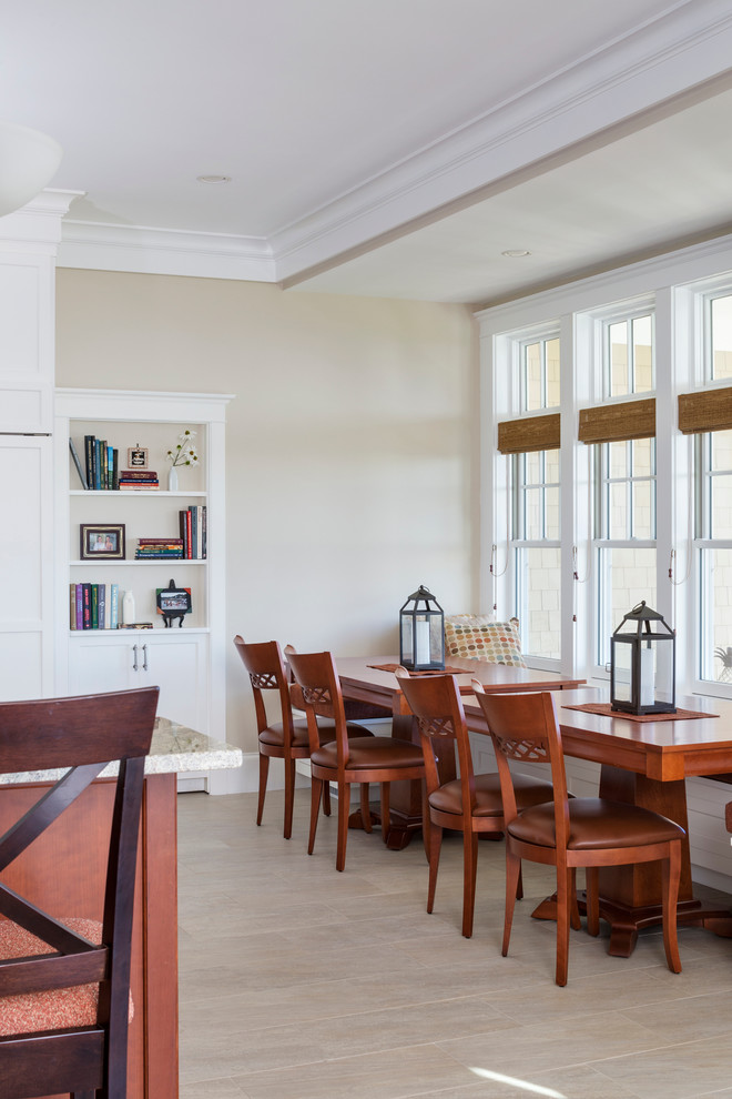 Large transitional l-shaped porcelain tile enclosed dining room photo in Boston with a single-bowl sink, raised-panel cabinets, white cabinets, granite countertops, metallic backsplash, glass tile backsplash, paneled appliances and two islands