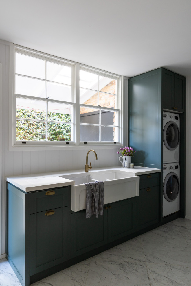 Photo of a traditional utility room in Sydney with shaker cabinets, shiplap splashback and marble floors.