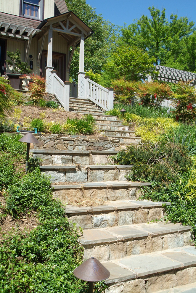 Country sloped garden in DC Metro with natural stone pavers.