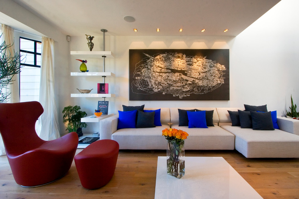 Contemporary living room in San Francisco with white walls and medium hardwood floors.