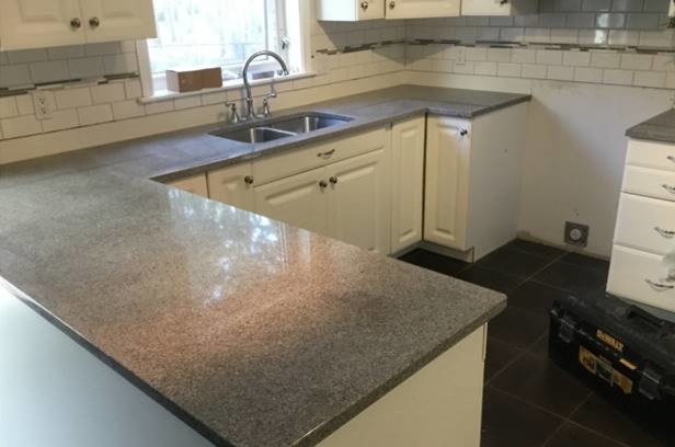 Inspiration for a small transitional kitchen remodel with granite countertops, stainless steel appliances and gray countertops