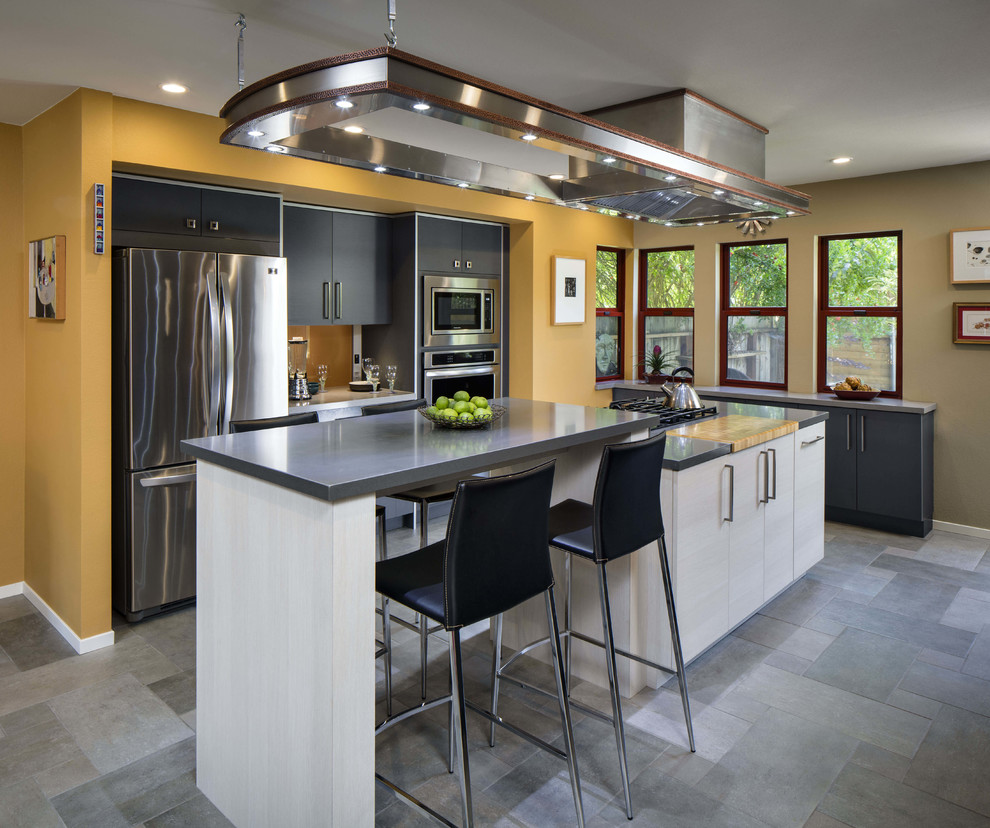 Inspiration for a contemporary galley kitchen in Sacramento with flat-panel cabinets, black cabinets and with island.