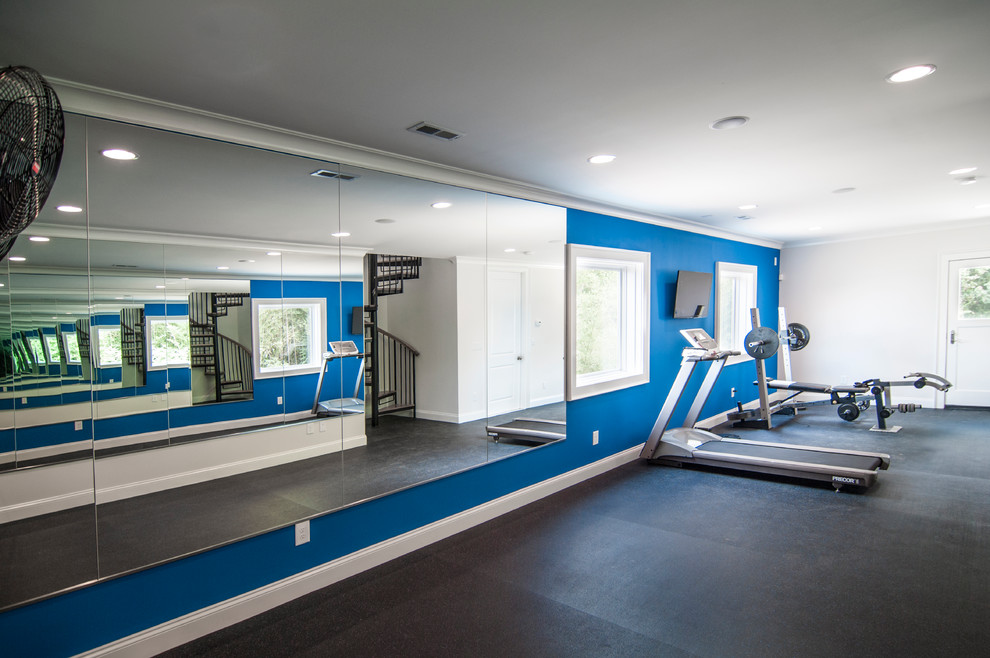 Mid-sized transitional multipurpose gym in Charlotte with blue walls and vinyl floors.