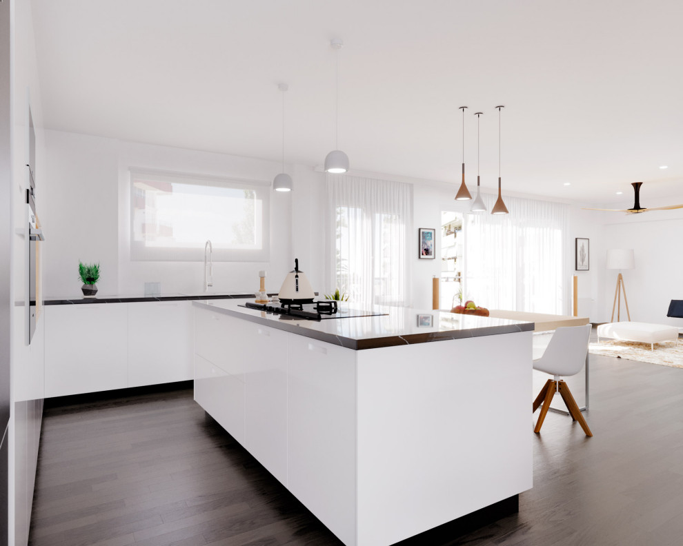 Exemple d'une cuisine américaine blanche et bois moderne de taille moyenne avec plan de travail en marbre, un électroménager en acier inoxydable, parquet foncé, îlot et plan de travail noir.