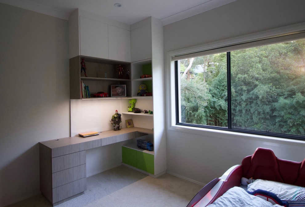 This is an example of a mid-sized contemporary kids' bedroom for kids 4-10 years old and boys in Sydney with grey walls and carpet.