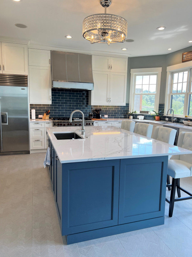 Photo of a medium sized traditional l-shaped open plan kitchen in Seattle with shaker cabinets, white cabinets, engineered stone countertops, an island and white worktops.