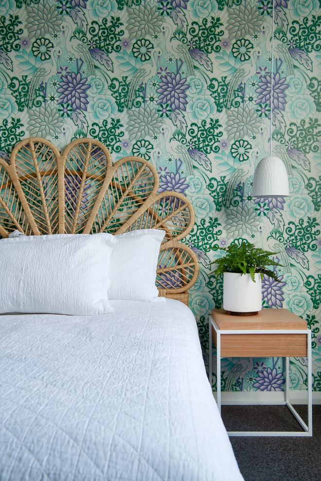 Inspiration for a mid-sized beach style guest bedroom in Perth with white walls and dark hardwood floors.