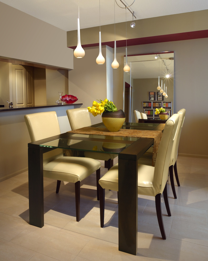 This is an example of a mid-sized contemporary open plan dining in Miami with brown walls and limestone floors.