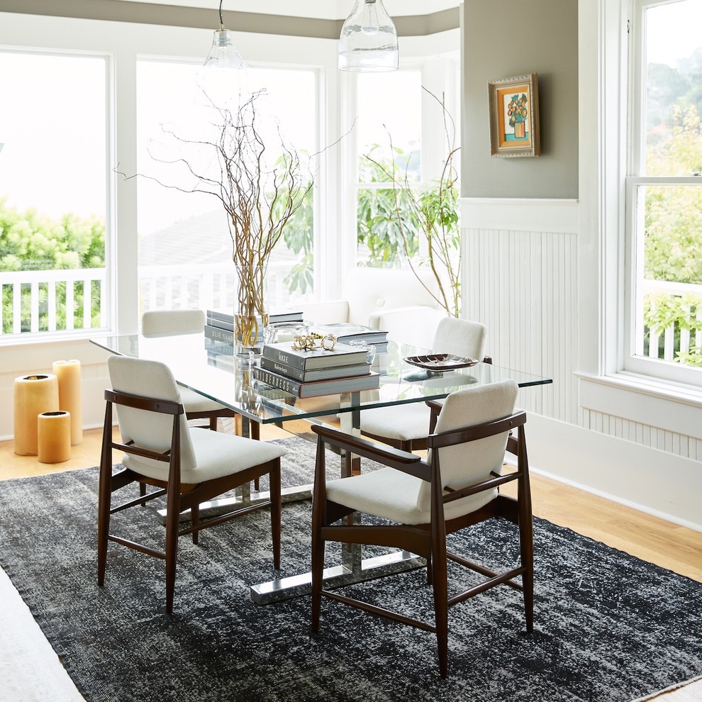 Inspiration for a transitional dining room in San Francisco with brown walls and light hardwood floors.