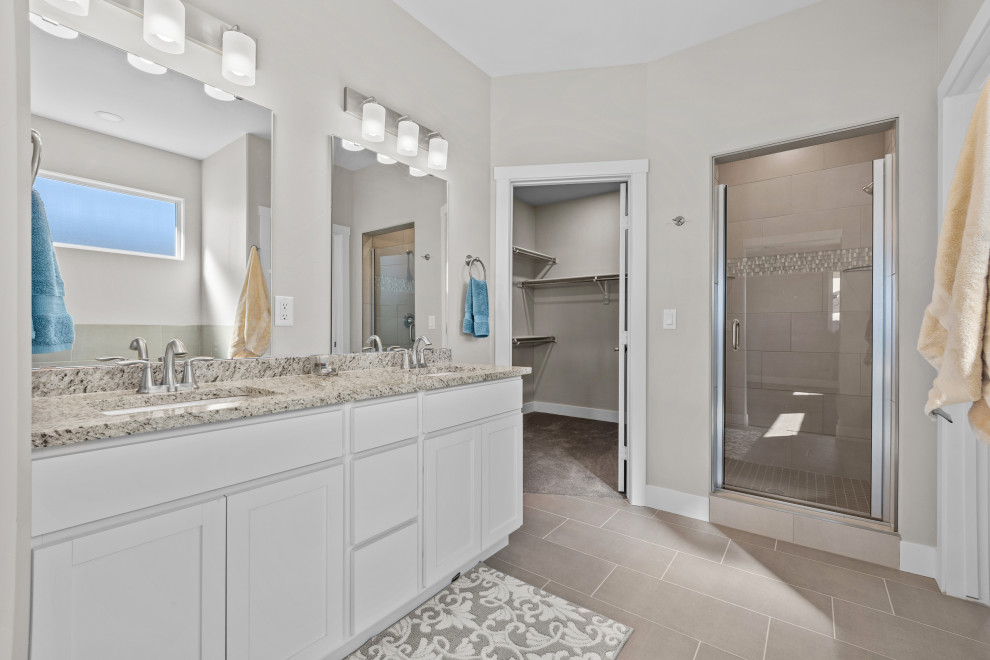 Photo of a medium sized classic ensuite bathroom in Denver with shaker cabinets, white cabinets, granite worktops, beige worktops, double sinks and a built in vanity unit.