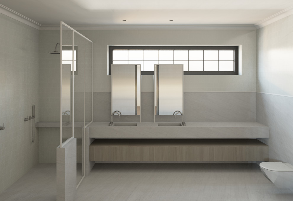 This is an example of a large contemporary master bathroom in Sydney with a double shower, marble floors, an integrated sink and marble benchtops.