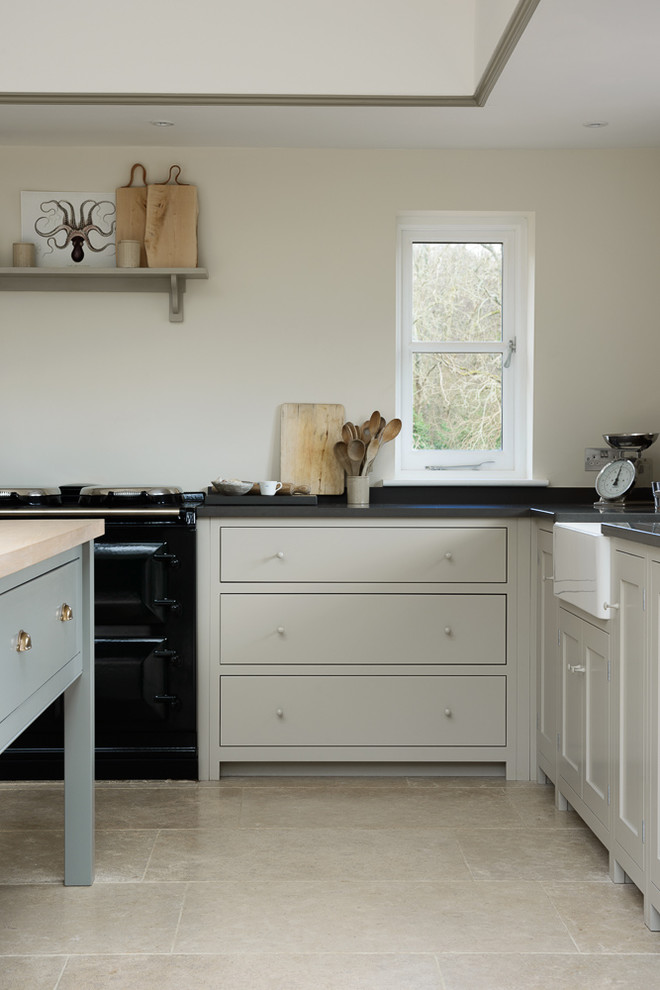Inspiration for a country eat-in kitchen in Other with shaker cabinets and with island.