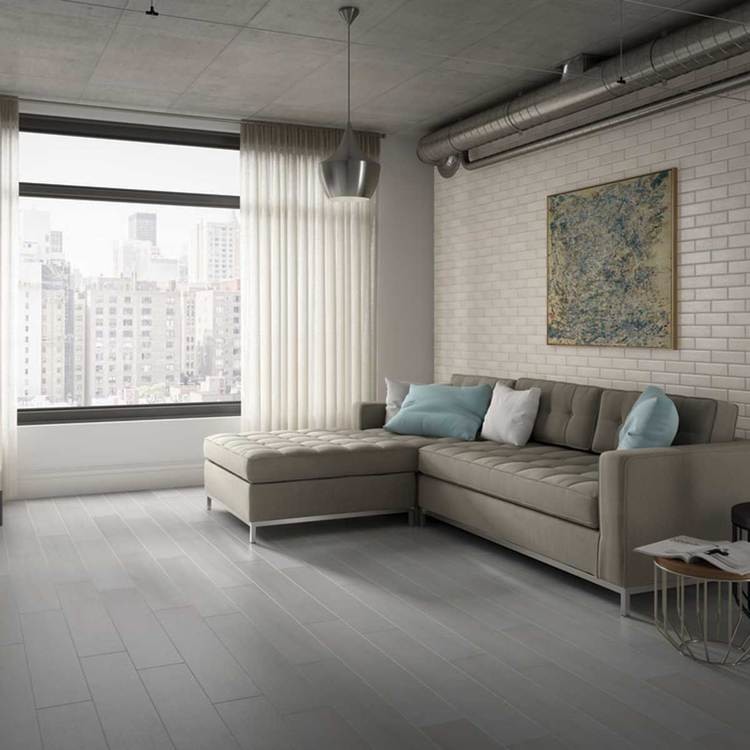 Design ideas for a mid-sized industrial formal open concept living room in New York with white walls, no fireplace, no tv and grey floor.