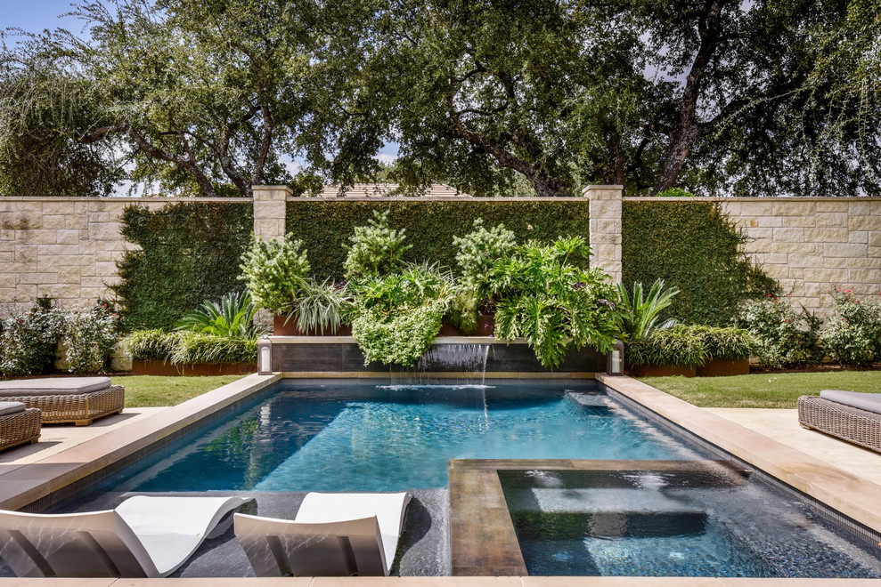 Transitional rectangular pool photo in Austin