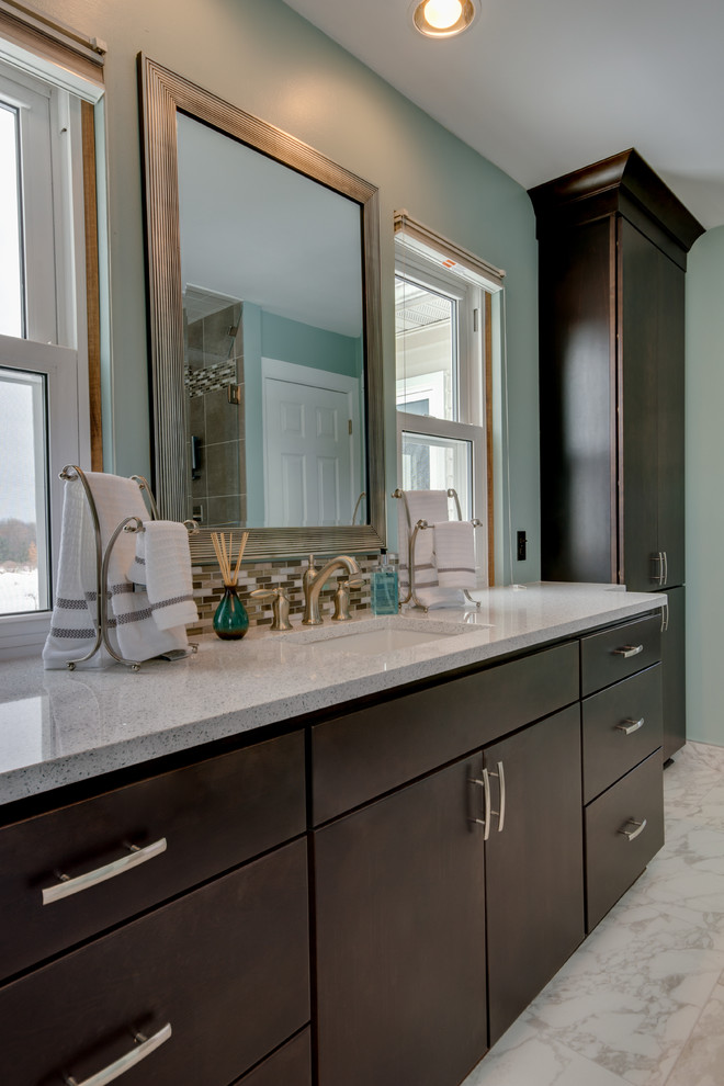Bathroom - mid-sized contemporary gray tile and stone tile ceramic tile bathroom idea in Detroit with an undermount sink, flat-panel cabinets, dark wood cabinets, quartz countertops, a two-piece toilet and blue walls