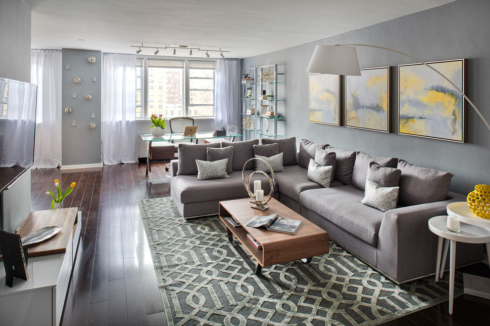 Design ideas for a transitional open concept living room in New York with grey walls and dark hardwood floors.