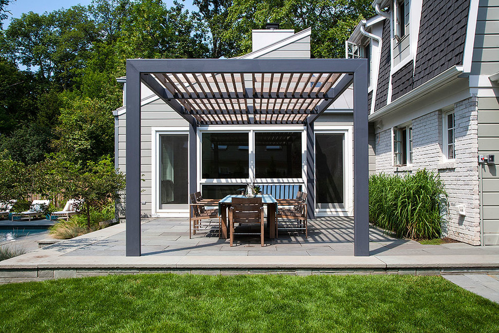 Inspiration for a contemporary patio remodel in Chicago with a pergola