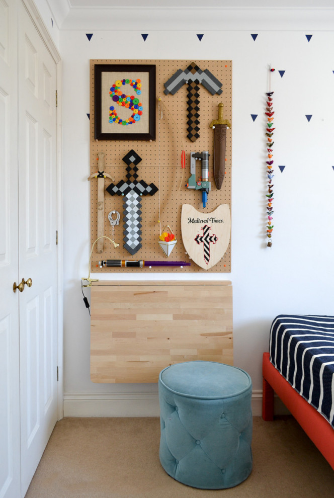 Design ideas for a small eclectic gender-neutral kids' bedroom for kids 4-10 years old with white walls and carpet.