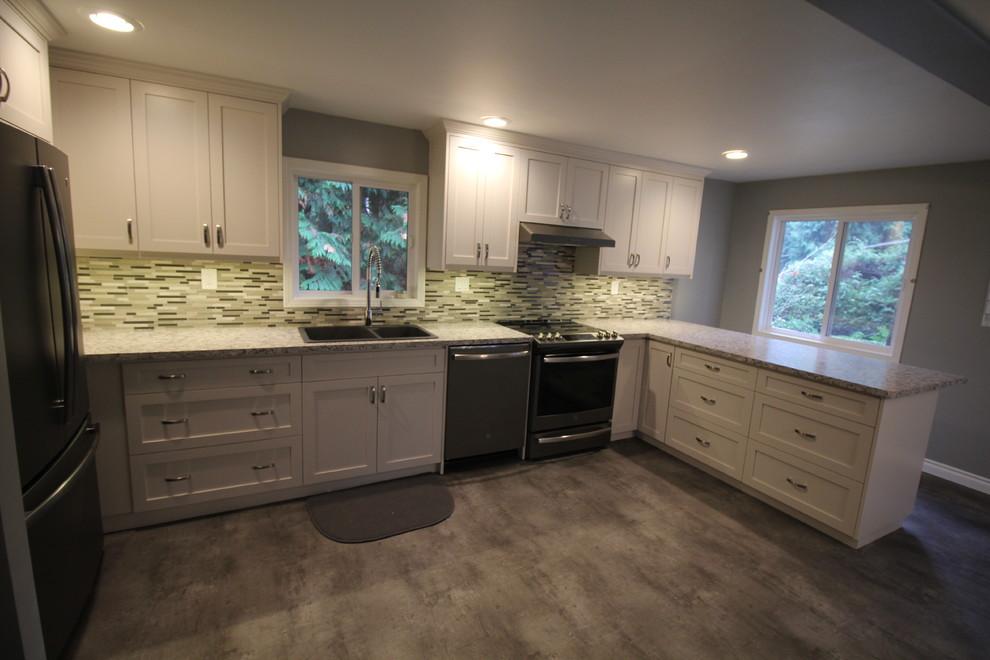 Eat-in kitchen - modern linoleum floor and gray floor eat-in kitchen idea with a drop-in sink, shaker cabinets, white cabinets, laminate countertops and glass tile backsplash