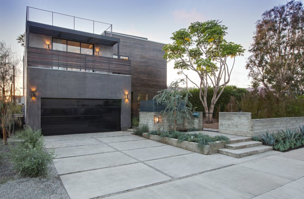 Contemporary two-story wood flat roof idea in Los Angeles