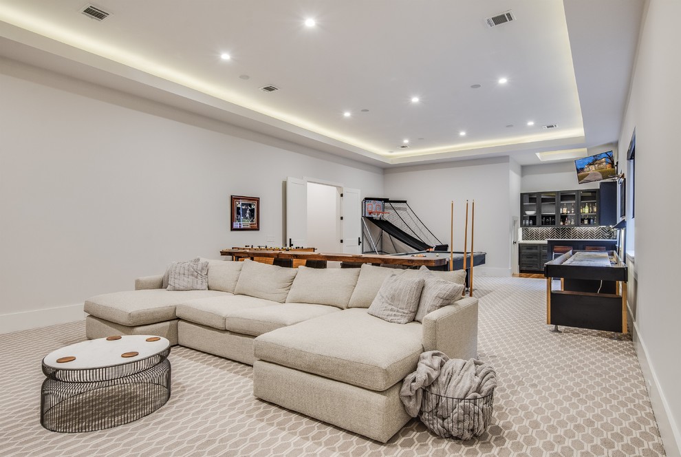 Photo of a mid-sized transitional open concept family room with a game room, white walls, carpet, a wall-mounted tv and multi-coloured floor.