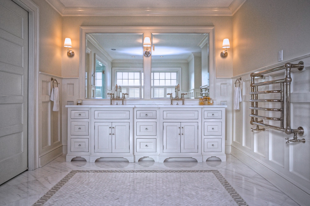 Freestanding bathtub - large traditional master marble floor and gray floor freestanding bathtub idea in New York with recessed-panel cabinets, white cabinets, a two-piece toilet, gray walls, an undermount sink, a hinged shower door and white countertops