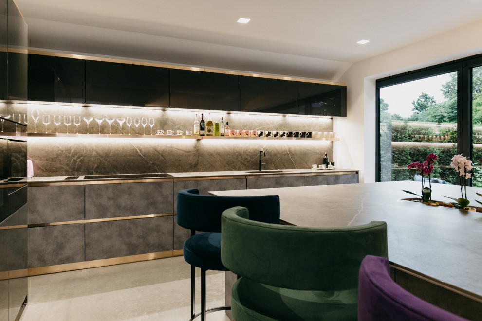 Inspiration for a medium sized contemporary home bar in Dorset with concrete flooring.