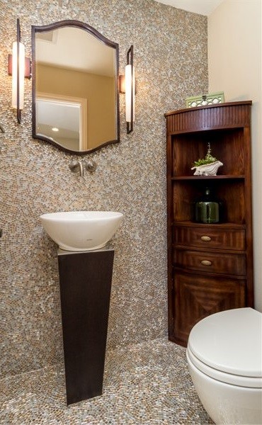 Photo of a small contemporary 3/4 bathroom in San Diego with flat-panel cabinets, dark wood cabinets, a one-piece toilet, multi-coloured tile, mosaic tile, beige walls and a vessel sink.
