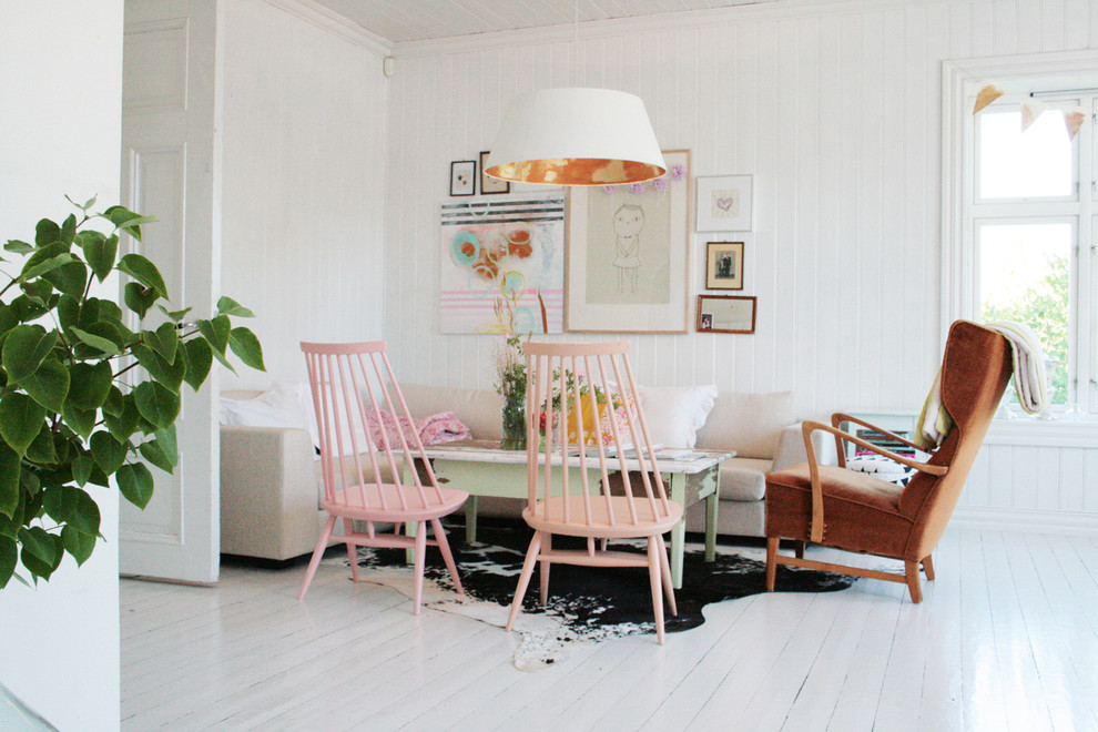 Photo of a small scandinavian dining room in Other with white walls and white floor.