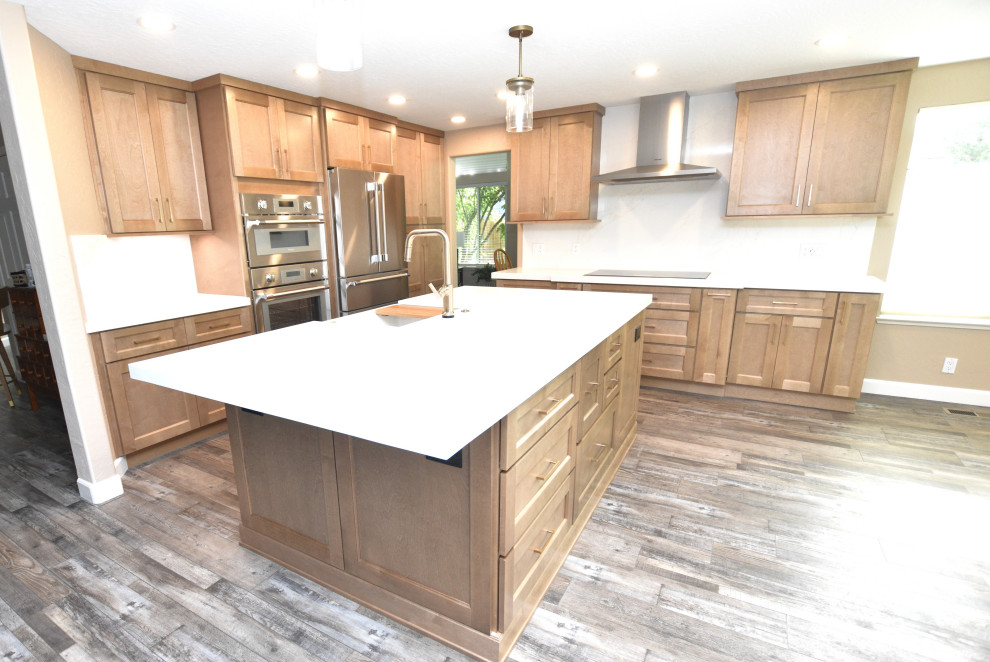Mid-sized transitional vinyl floor eat-in kitchen photo with a farmhouse sink, shaker cabinets, medium tone wood cabinets, quartzite countertops, white backsplash, stone slab backsplash, stainless steel appliances, an island and white countertops