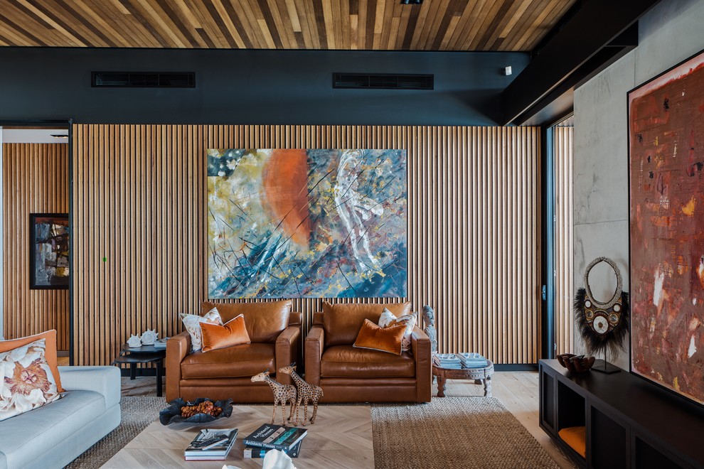 Contemporary living room in Gold Coast - Tweed with brown walls, light hardwood floors and beige floor.