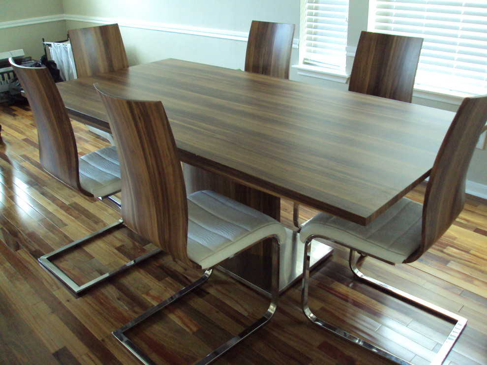 Inspiration for a medium sized contemporary dining room in Houston with medium hardwood flooring.