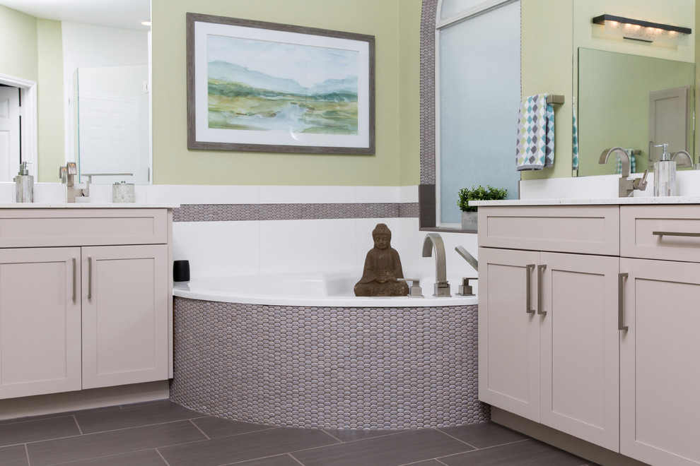 Inspiration for a mid-sized contemporary master bathroom in Dallas with shaker cabinets, beige cabinets, a corner tub, brown tile, mosaic tile, green walls, ceramic floors, an undermount sink and engineered quartz benchtops.