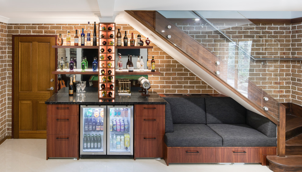 Design ideas for a contemporary home bar in Sydney with grey floor.