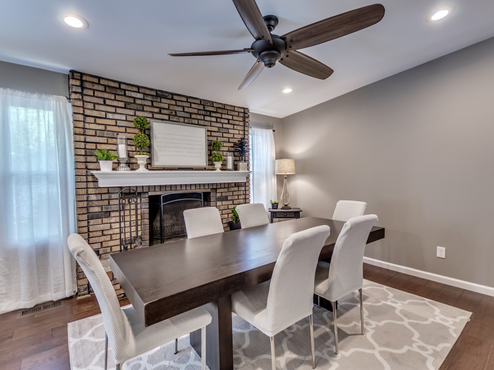 Eat-in kitchen - mid-sized transitional u-shaped brown floor eat-in kitchen idea in St Louis with an island, white cabinets, granite countertops, subway tile backsplash, stainless steel appliances, multicolored countertops and white backsplash